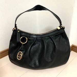 Gucci Black Hobo Bag with Gold Accents